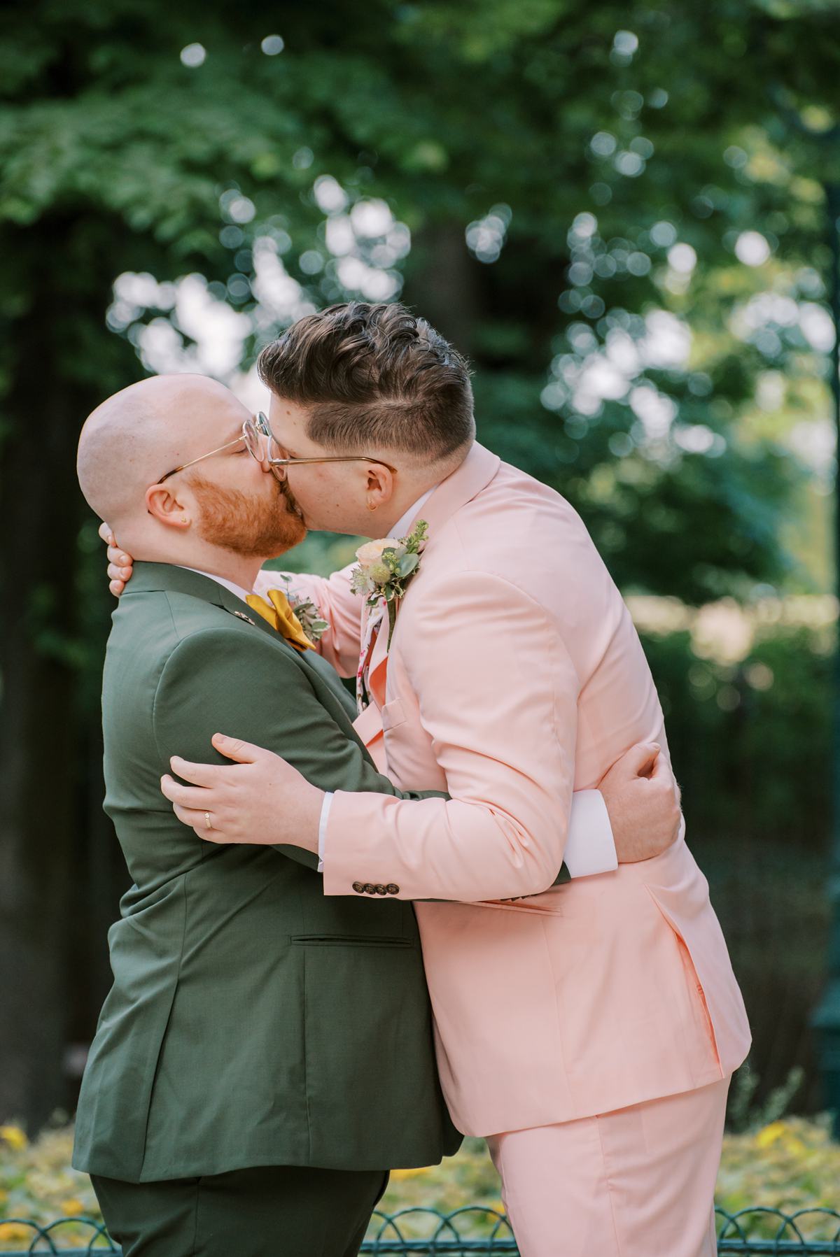 Two men in suits kissing during a gay photoshoot with Amsterdam-based photographer Paige Gribb.